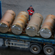 A truck carries containers with low-enriched uranium to be used as fuel for nuclear reactors, on a port in St. Petersburg, Russia, Thursday, Nov. 14, 2013. A 20-year program to convert highly enriched uranium from dismantled Russian nuclear weapons into fuel for U.S. power plants has ended, with the final shipment loaded onto a vessel in St. Petersburg’s port on Thursday. The U.S. Energy Department described the program, commonly known as Megatons to Megawatts, as one of the most successful nuclear nonproliferation partnerships ever undertaken. (AP Photo/Dmitry Lovetsky)